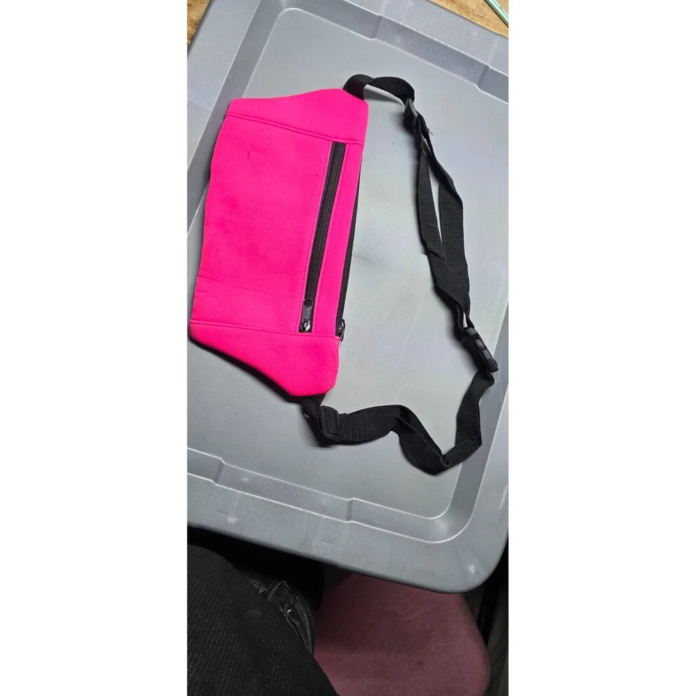neon pink neoprene running belt or fanny pack with a clear phone window